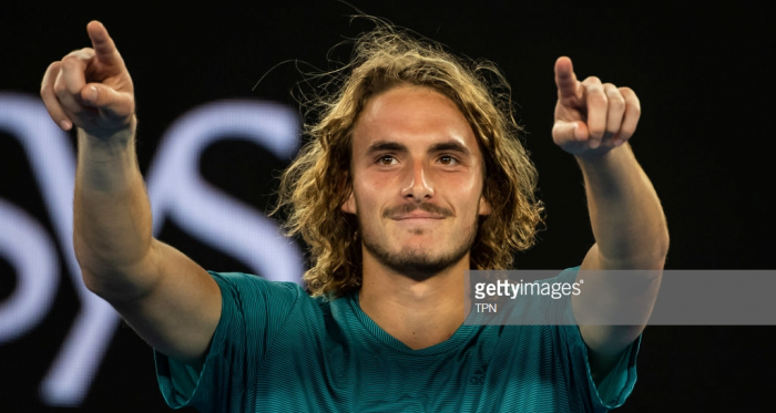 Stefanos Tsitsipas points to his box after upsetting Roger Federer (TPN/Getty Images)