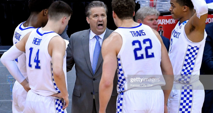 Calipari in the huddle with his team during their Elite 8 game vs Auburn (Kansas City Star/Getty Images)