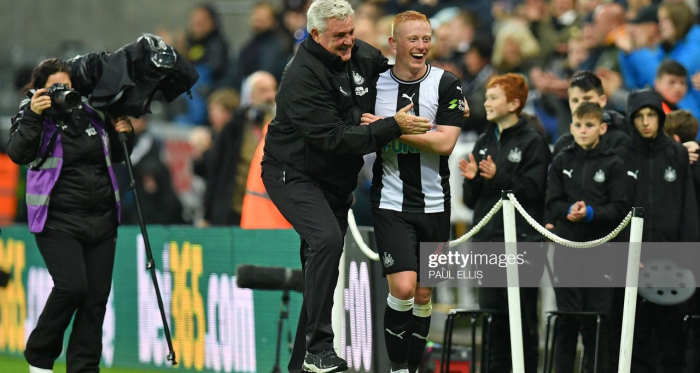 Newcastle United's English head coach Steve Bruce (centre left) congratulates goalscorer Newcastle United's English midfielder Matthew Longstaff (centre right) after the English Premier League football match between Newcastle United and Manchester United at St James's Park in Newcastle-upon-Tyne, north east England on October 6, 2019. - Newcastle won the game 1-0. (Photo by Paul ELLIS / AFP)