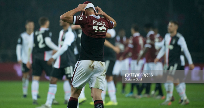 Torino's Cristian Ansaldi covers his face in disappointment after their 1-0 loss to Juventus last weekend (Getty Images/Stefano Guidi) 