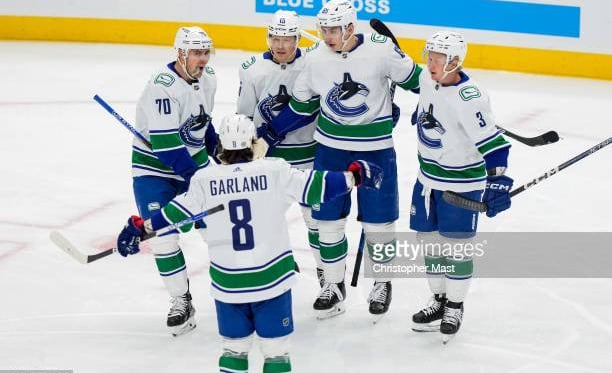 Canucks hang on against Kraken for first win of the season