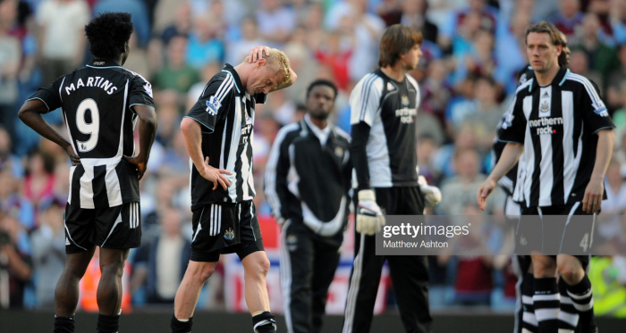 Damien Duff of Newcastle United pictured (C) at the end of the game after he scored an own goal to relegate his team (Photo by AMA/Corbis via Getty Images)