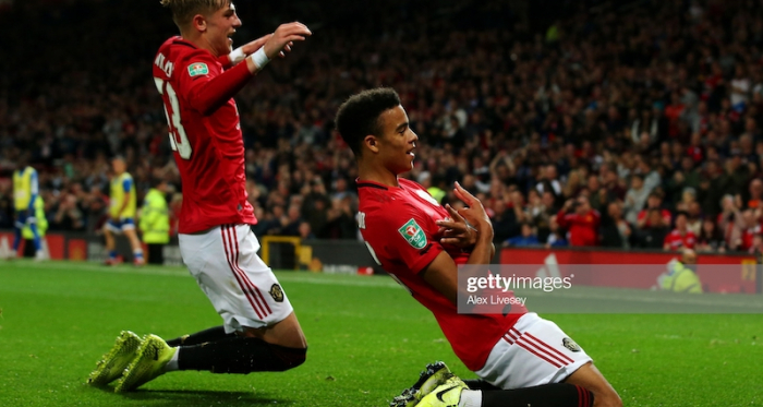 MANCHESTER, ENGLAND - SEPTEMBER 25: Mason Greenwood of Manchester United celebrates scoring his teams first goal of the game with team mate Brandon Williams during the Carabao Cup Third Round match between Manchester United and Rochdale AFC at Old Trafford on September 25, 2019 in Manchester, England. (Photo by Alex Livesey/Getty Images)