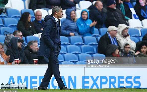 Chris Hughton in the dugout during the 5-0 defeat Bournemouth. Image courtesy of Charlie Crowhurst on Getty Images.