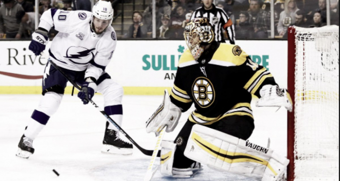 J.T. Miller looks at the puck in front of Bruins netminder Tuukka Rask. | Photo: Raw Charge - SB Nation