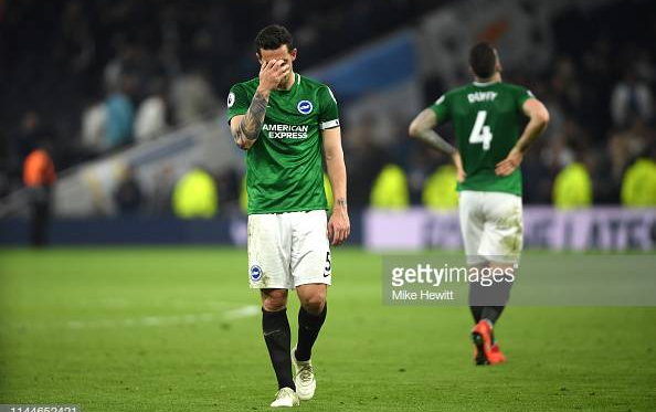 Lewis Dunk (left) and Shane Duffy (right) look demoralised after their late defeat to Tottenham. Image courtesy of Mike Hewitt on Getty Images.