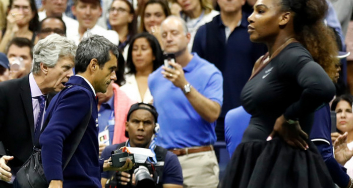 Serena Williams looks on as chair umpire Carlos Ramos is escorted off the court by U.S. Open tournament referee Brian Earley. | Photo: <span style="color: rgb(153, 153, 153); font-family: helvetica, arial, verdana, sans-serif; font-style: normal; text-align: start; background-color: rgb(255, 255, 255);">Julian Finney/Getty Images</span>