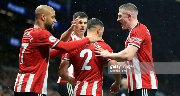 <div>LONDON, ENGLAND - NOVEMBER 09: George Baldock of Sheffield United celebrates with teammates after scoring his team's first goal during the Premier League match between Tottenham Hotspur and Sheffield United at Tottenham Hotspur Stadium on November 09, 2019 in London, United Kingdom. (Photo by Stephen Pond/Getty Images)</div>