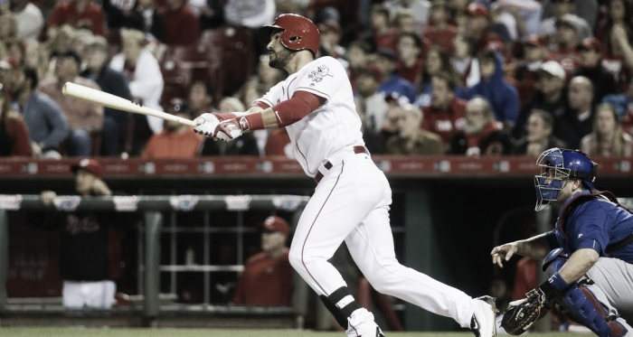 Cincinnati Reds Eugenio Suarez, left, hits a go-ahead three-run home run off Chicago Cubs starting pitcher John Lackey in the sixth inning during Saturday April 23, 2016 (John Minchillo/AP)