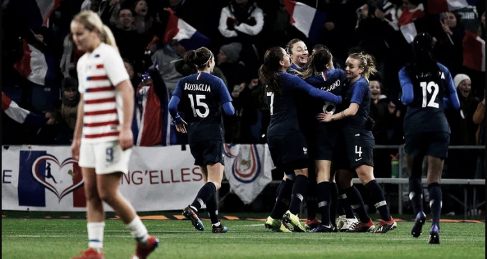 Midfielder Lindsey Horan (left) walks away as France celebrates a goal. | Associated Press
