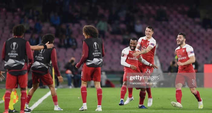 Arsenal players celebrate the 0-1 goal scored by Alexandre Lacazette during the UEFA Europa League Quarter Final Second Leg match between S.S.C. Napoli and Arsenal at Stadio San Paolo on April 18, 2019 in Naples, Italy. (Photo by Francesco Pecoraro/Getty Images)