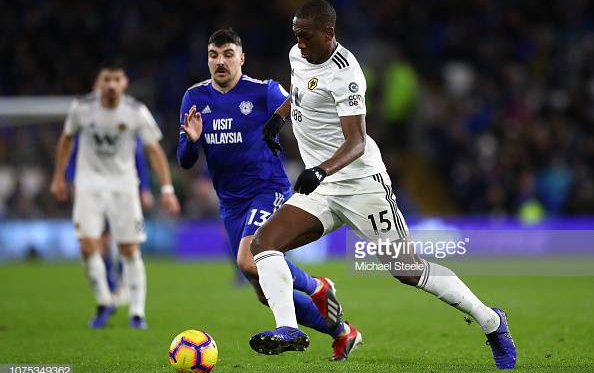 Willie Boly of Wolverhampton Wanderers tracked by Callum Paterson of Cardiff City during the Premier League match between Cardiff City and Wolverhampton Wanderers at Cardiff City Stadium on November 30, 2018 in Cardiff, United Kingdom. (Photo by Michael Steele/Getty Images)