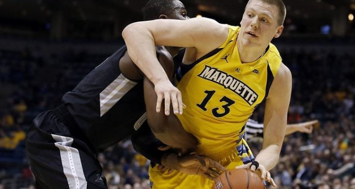 Ben Bentil and Henry Ellenson, the two stars of Wednesday's tussle, battle in the paint. (Photo credit: AP)