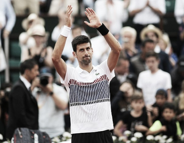 French Open: Novak Djokovic survives an almighty scare to continue his title defense into the second week