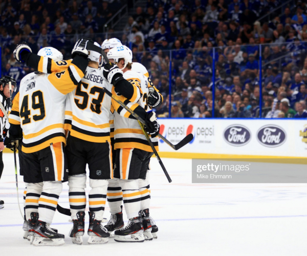 Shorthanded Penguins rout two-time defending champion Lightning on opening night
