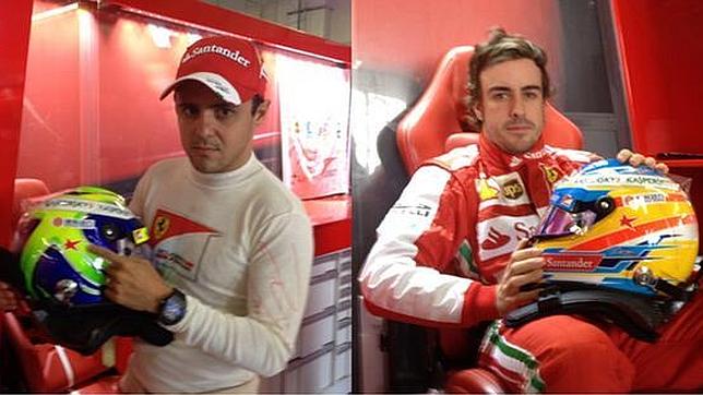 Fernando Alonsoy Felipe Massa muestran las estrellas en sus cascos en honor a María | Foto vía abc.es
