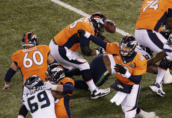 Ball is snapped high pass Manning for safety in Super Bowl XLVIII/ Getty Images