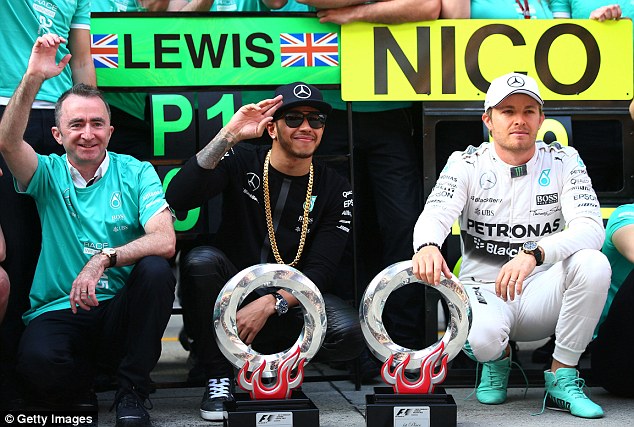 Lewis Hamilton celebrates his win with the Mercedes team, but Nico Rosberg appears less pleased with 2nd 