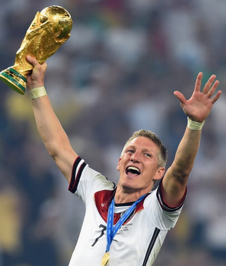 Schweinsteiger with the famous World Cup trophy.