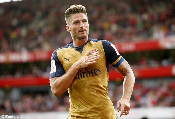 Olivier Giroud celebrates his and Arsenal first goal of the game. (Daily Mail)