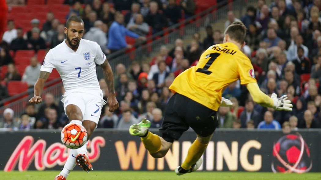 Theo Walcott opens the scoring for England.