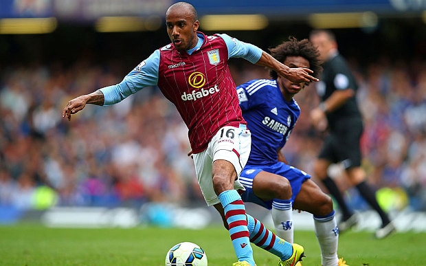 Delph (pictured here with Villa) shields the ball away from Chelsea's Willian last term