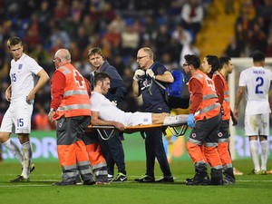 Michael Carrick is carried off by stretcher