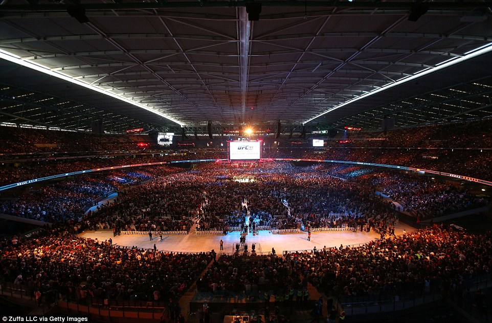 Excellent view: A record crowd look on as Holm beat Rousey to become the new champion 