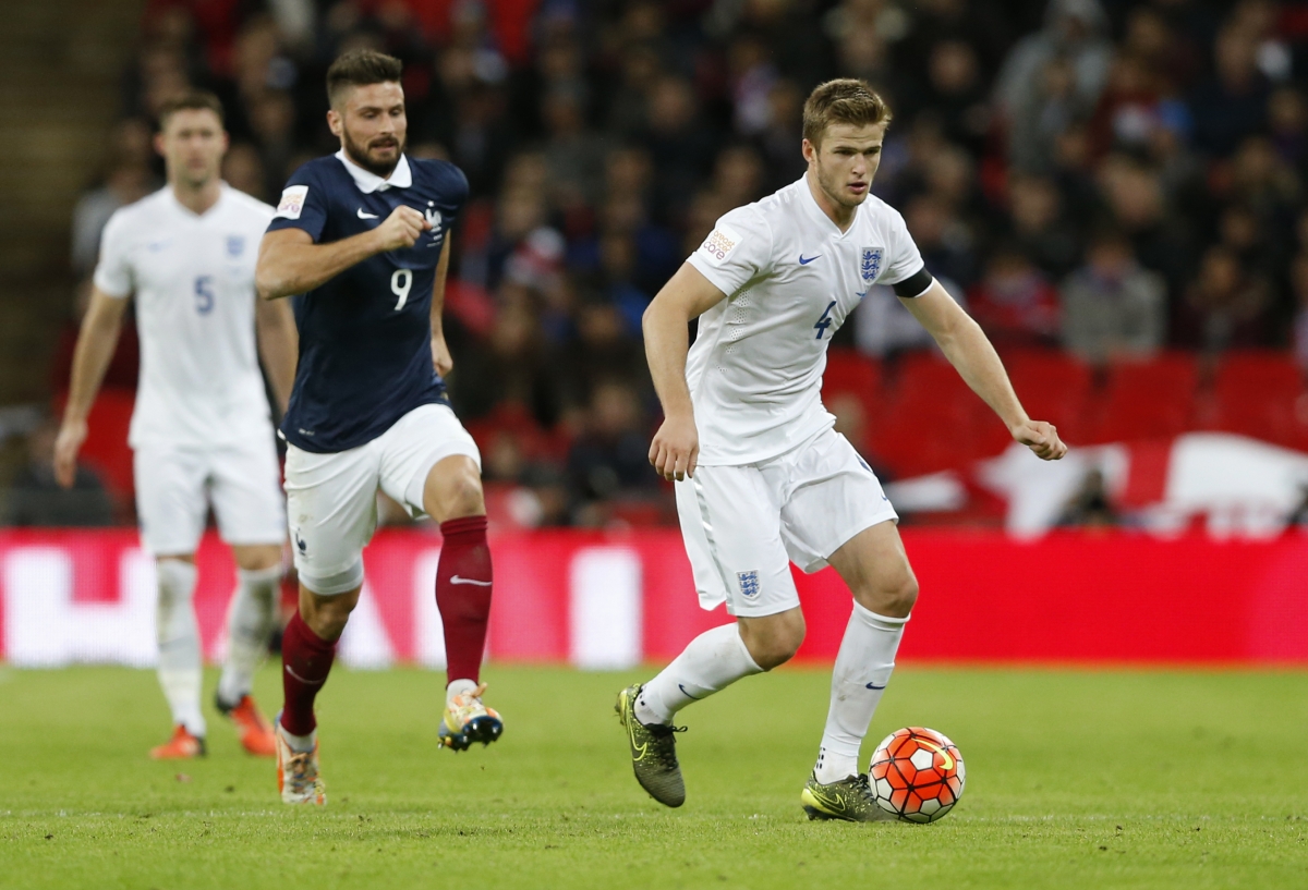 Eric Dier representing England with France's Olivier Giroud just behind. (IBTimes)