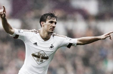 Swansea City 3-1 Liverpool: Ayew at the double as Swans secure safety in style