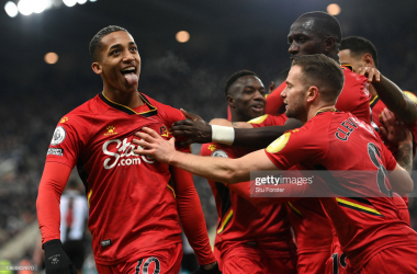 <span>NEWCASTLE UPON TYNE, ENGLAND - JANUARY 15: Joao Pedro of Watford FC celebrates with teammates after scoring their team's first goal during the Premier League match between Newcastle United and Watford at St. James Park on January 15, 2022 in Newcastle upon Tyne, England. (Photo by Stu Forster/Getty Images)</span>