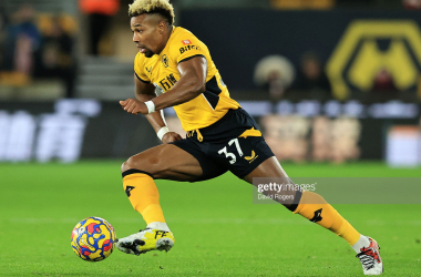 WOLVERHAMPTON, ENGLAND - DECEMBER 01: Adama Traore of Wolverhampton Wanderers runs with the ball during the Premier League match between Wolverhampton Wanderers and Burnley at Molineux on December 01, 2021 in Wolverhampton, England. (Photo by David Rogers/Getty Images)