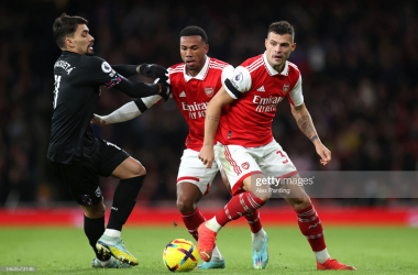 <span>LONDON, ENGLAND - DECEMBER 26: Gabriel Magalhaes and Granit&nbsp;Xhaka of Arsenal battle for possession with Lucas Paqueta of West Ham United during the Premier League match between Arsenal FC and West Ham United at Emirates Stadium on December 26, 2022 in London, England. (Photo by Alex Pantling/Getty Images)</span>