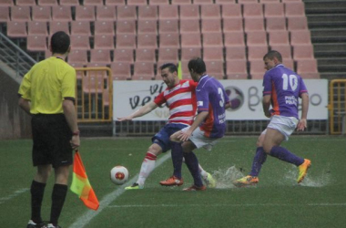 Empate entre Granada B y Guadalajara bajo la lluvia