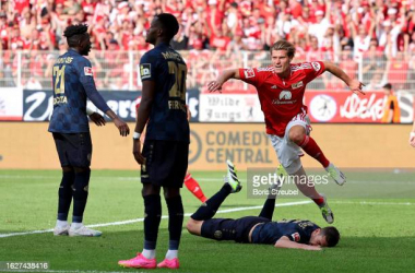 BERLIN, GERMANY - AUGUST 20: Kevin Behrens of 1. FC Union Berlin celebrates after scoring the team's third goal during the Bundesliga match between 1. FC Union Berlin and 1. FSV Mainz 05 at An der Alten Foersterei on August 20, 2023 in Berlin, Germany. (Photo by Boris Streubel/Getty Images)
