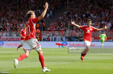 Union Berlin's German forward #17 Kevin Behrens celebrates scoring the 2-0 goal with his teammates during the German first division Bundesliga football match between 1 FC Union Berlin and 1 FSV Mainz 05 in Berlin on August 20, 2023. (Photo by Odd ANDERSEN / AFP) / DFL REGULATIONS PROHIBIT ANY USE OF PHOTOGRAPHS AS IMAGE SEQUENCES AND/OR QUASI-VIDEO (Photo by ODD ANDERSEN/AFP via Getty Images)