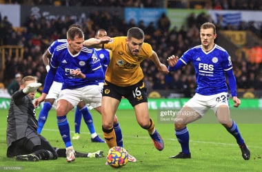 WOLVERHAMPTON, ENGLAND - FEBRUARY 20: Conor Coady of Wolverhampton Wanderers is challenged by Kiernan Dewsbury-Hall of Leicester City during the Premier League match between Wolverhampton Wanderers and Leicester City at Molineux on February 20, 2022 in Wolverhampton, England. (Photo by David Rogers/Getty Images)
