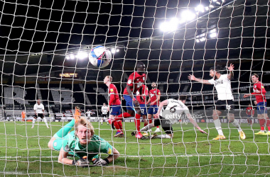 <div>Derby County v Huddersfield Town - Sky Bet Championship</div><div>DERBY, ENGLAND - FEBRUARY 23: George Edmundson of Derby County scores their sides first goal past Ryan Schofield of Huddersfield Town during the Sky Bet Championship match between Derby County and Huddersfield Town at Pride Park Stadium on February 23, 2021 in Derby, England. Sporting stadiums around the UK remain under strict restrictions due to the Coronavirus Pandemic as Government social distancing laws prohibit fans inside venues resulting in games being played behind closed doors. (Photo by Alex Pantling/Getty Images)</div>