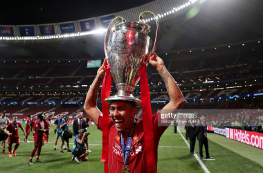 <span>Roberto Firmino of Liverpool lifts the Champions League Trophy following the UEFA Champions League Final between Tottenham Hotspur and Liverpool at Estadio Wanda Metropolitano on June 01, 2019 in Madrid, Spain. (Photo by Gonzalo Arroyo - UEFA/UEFA via Getty Images)</span>