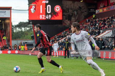 Mathias Jensen (right) chases Bournemouth's Adam Smith in the 2020/21 Championship Play-off semi-final first leg.&nbsp;Photo by David Horton - CameraSport via Getty Images.&nbsp;