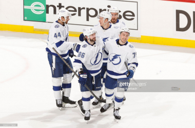 Ross Colton (r.) celebrates with teammates after his goal won Game 2/Photo: Joel Auerbach/Getty Images