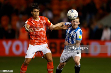 Kenny Dougall of Blackpool and Lewis O'Brien of Huddersfield Town battle for the ball during the corresponding fixture last season/Photo: John Early/Getty Images