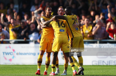 Sutton United 4-3 Port Vale: Yellow Army into play-off places after Rowe stoppage time winner