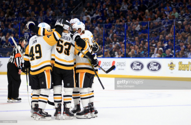 Shorthanded Penguins rout two-time defending champion Lightning on opening night