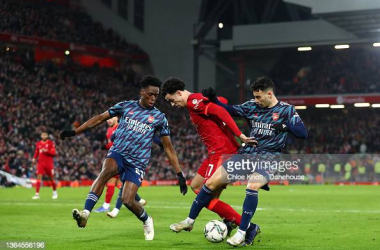 Gabriel Martinelli of Arsenal tackles Curtis Jones of Liverpool during the Carabao Cup Semi Final First Leg match between Liverpool and Arsenal at Anfield on January 13, 2022 in Liverpool, England. (Photo by Chloe Knott - Danehouse/Getty Images)