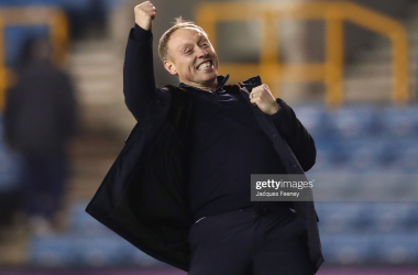 Steve Cooper celebrates victory after the final whistle at The Den
