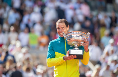 Nadal with his signature trophy bite (Tim Corbis/Getty Images)