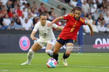 Lucy Bronze attempts to dispossess Aitana Bonmatí when England and Spain last met at the European Championships (Photo by Catherine Ivill - UEFA/UEFA via Getty Images)