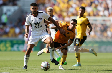 <span>WOLVERHAMPTON, ENGLAND - AUGUST 13: Max Kilman (R) of Wolverhampton Wanderers holds off Aleksandar Mitrovic during the Premier League match between Wolverhampton Wanderers and Fulham FC at Molineux on August 13, 2022 in Wolverhampton, England. (Photo by David Rogers/Getty Images)</span>