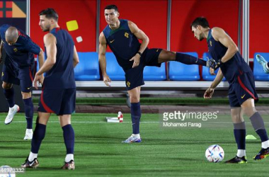Cristiano Ronaldo (centre) stretches during Portugal's training session in Doha on 27th November 2022: Mohamed Farag/Getty Images